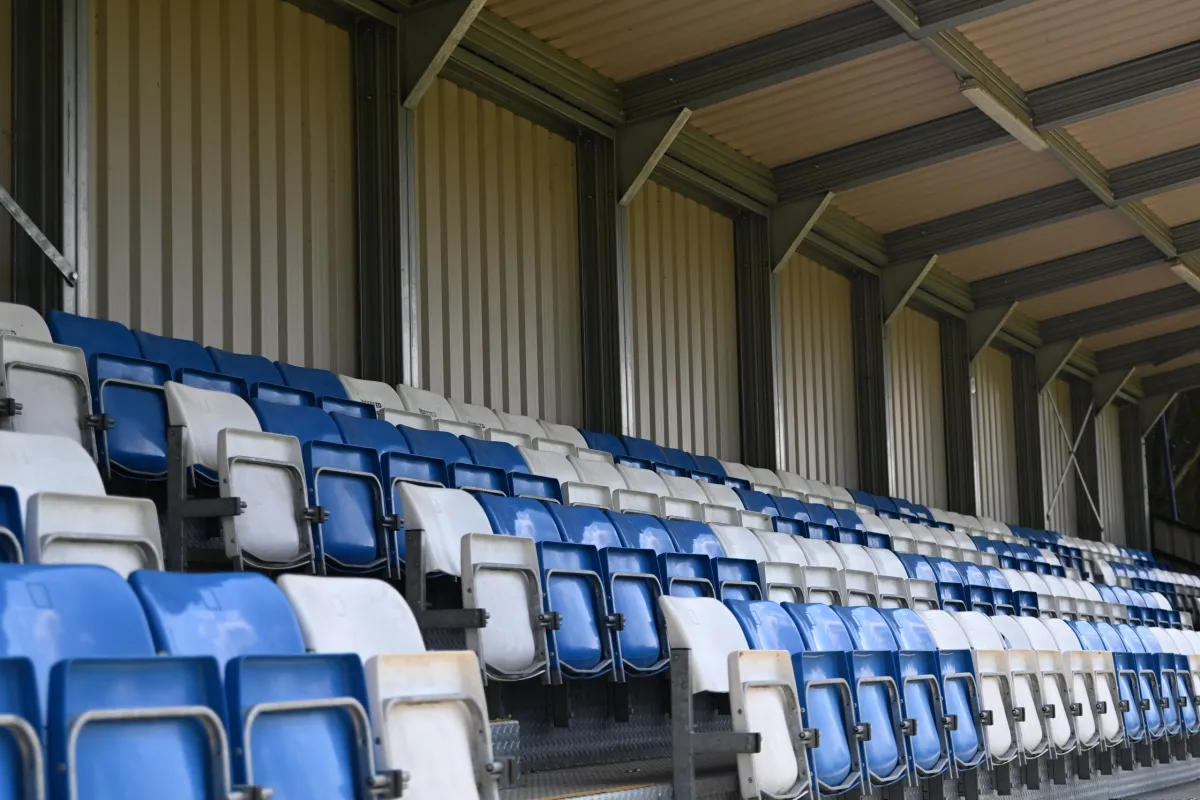 Blue and white seats in the stand