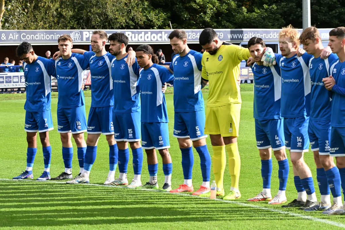 The teams line up in front of the main stand