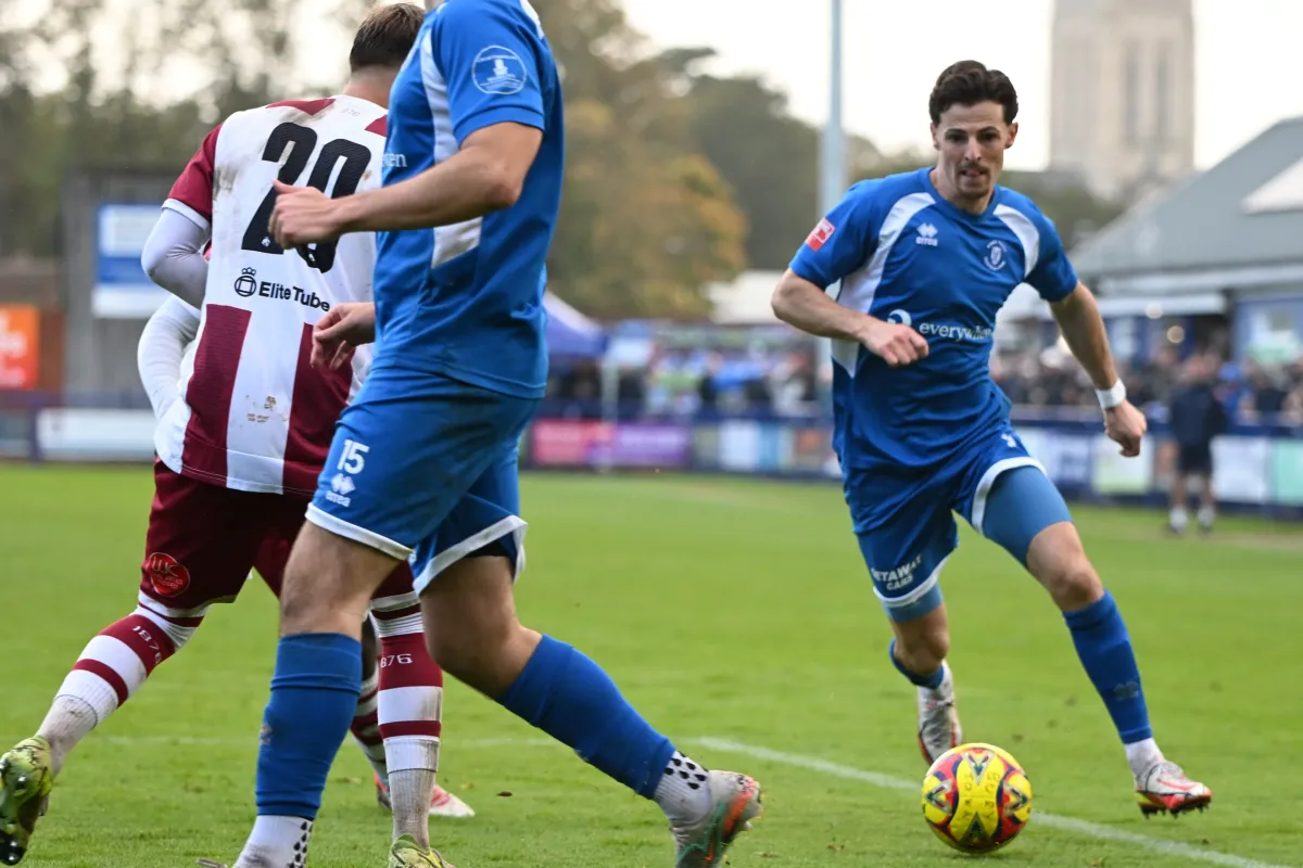 Matchday at Ram Meadow, the cathedral tower over the far side